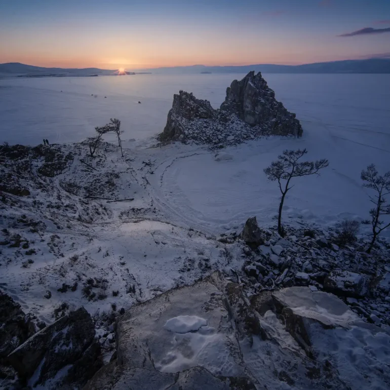 Shaman Rock glowing at sunset on Olkhon Island, overlooking Lake Baikal in Siberia, Russia.