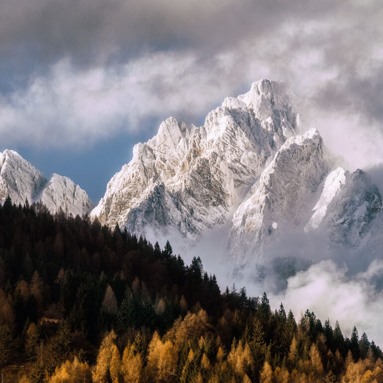 The rugged Marmarole peaks beneath dramatic storm clouds on an autumn day in the UNESCO-listed Italian Dolomites.