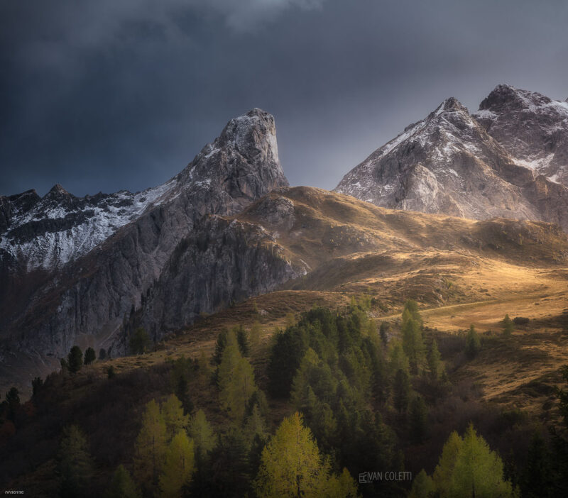 A unique view of Passo Giau illuminated by the warm colours of an autumn sunset in the Italian Dolomites.