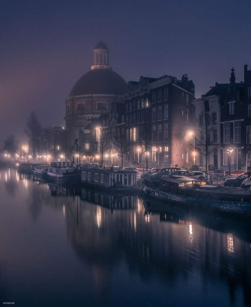 Traditional boats moored along Amsterdam
