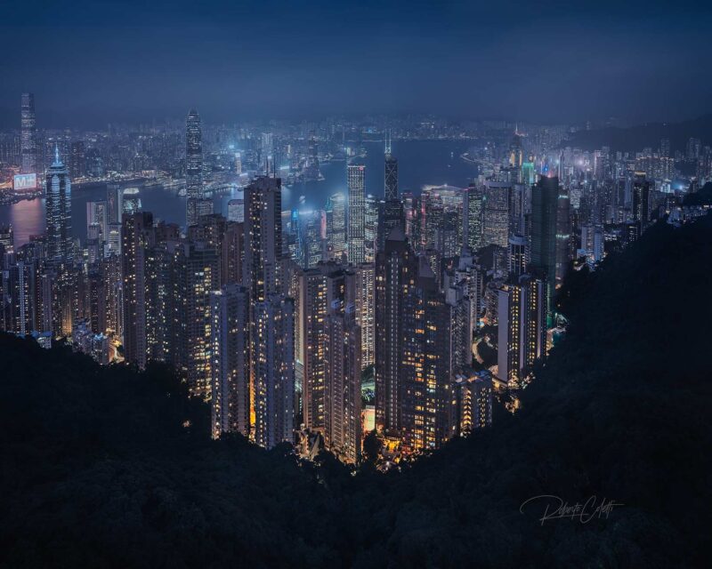 Panoramic night view of the Hong Kong skyline from Victoria Peak (The Peak), overlooking Victoria Harbour and the city