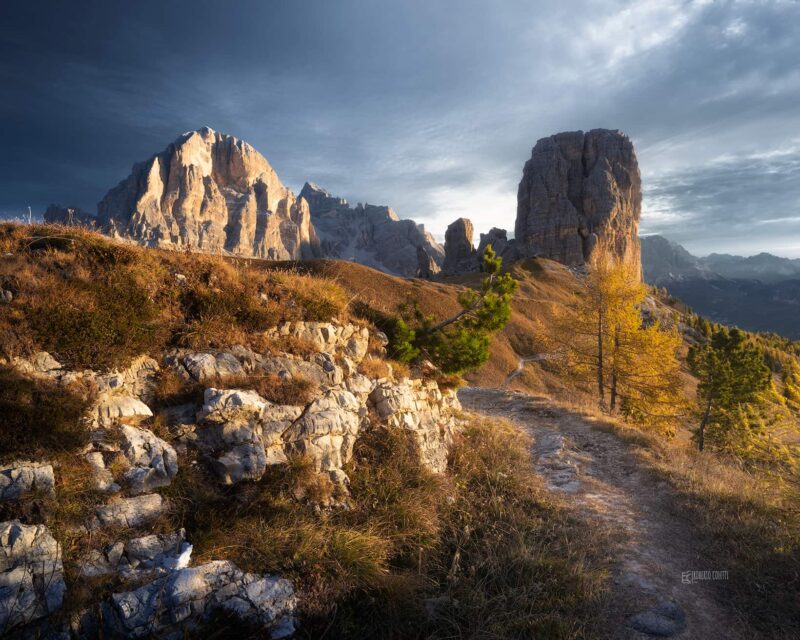 Cinque Torri standing before the majestic Tofana di Rozes on a peaceful autumn morning near Cortina d