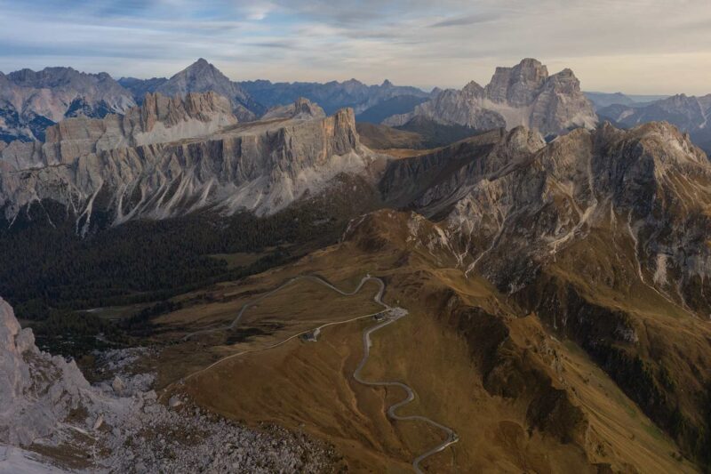 Aerial view of Passo Giau in the Dolomites, Italy, overlooking Monte Pelmo and Lastoi di Formin on an October autumn evening.