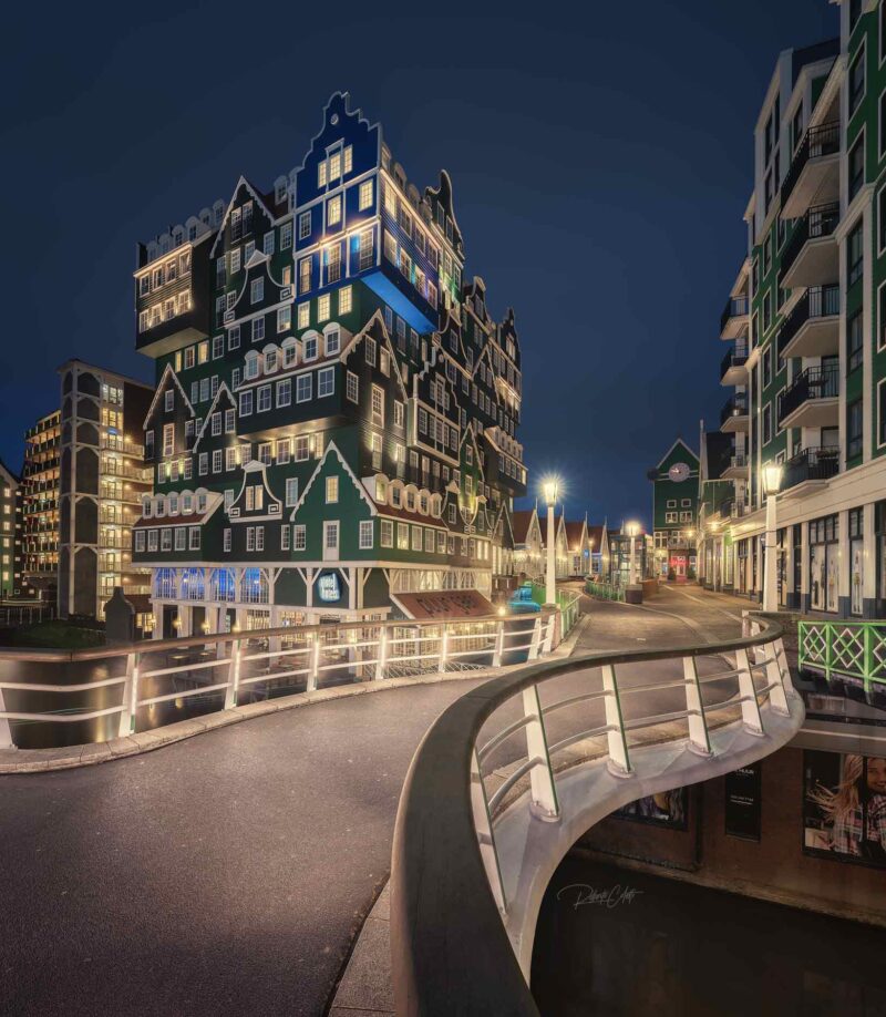 The iconic Inntel Hotels Amsterdam Zaandam illuminated at night, inspired by traditional Dutch houses in Zaandam, the Netherlands.